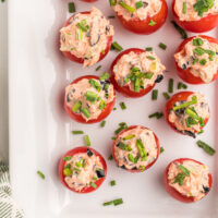 salmon stuffed cherry tomatoes on platter