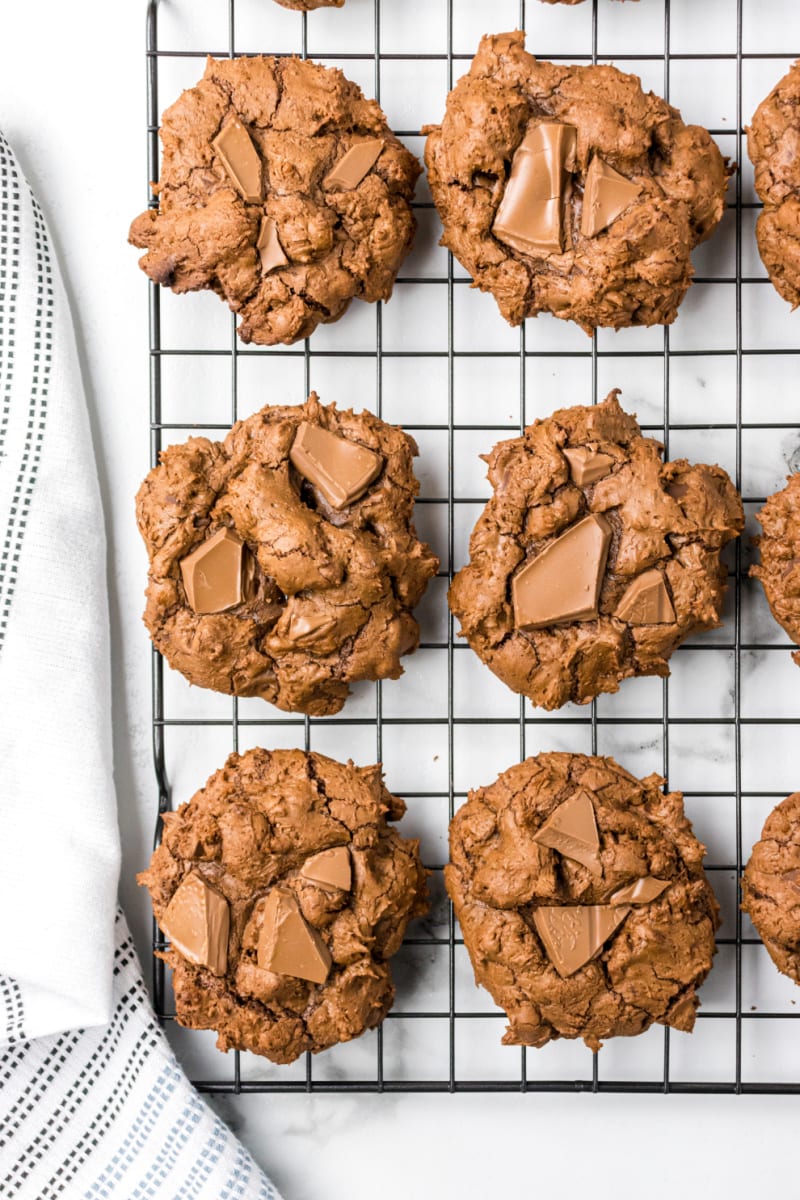 triple chocolate chunk cookies on a cooling rack