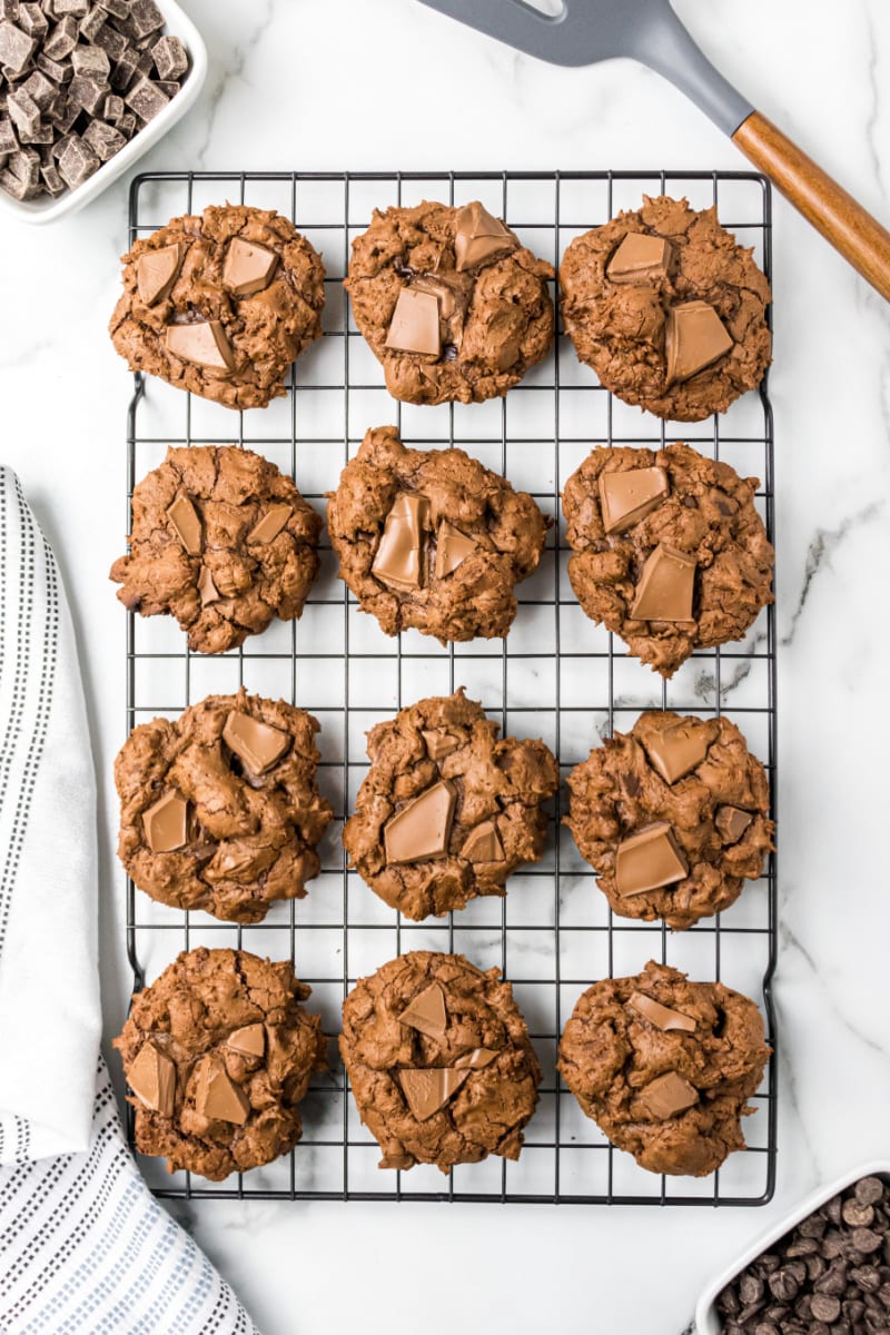 triple chocolate chunk cookies on a cooling rack