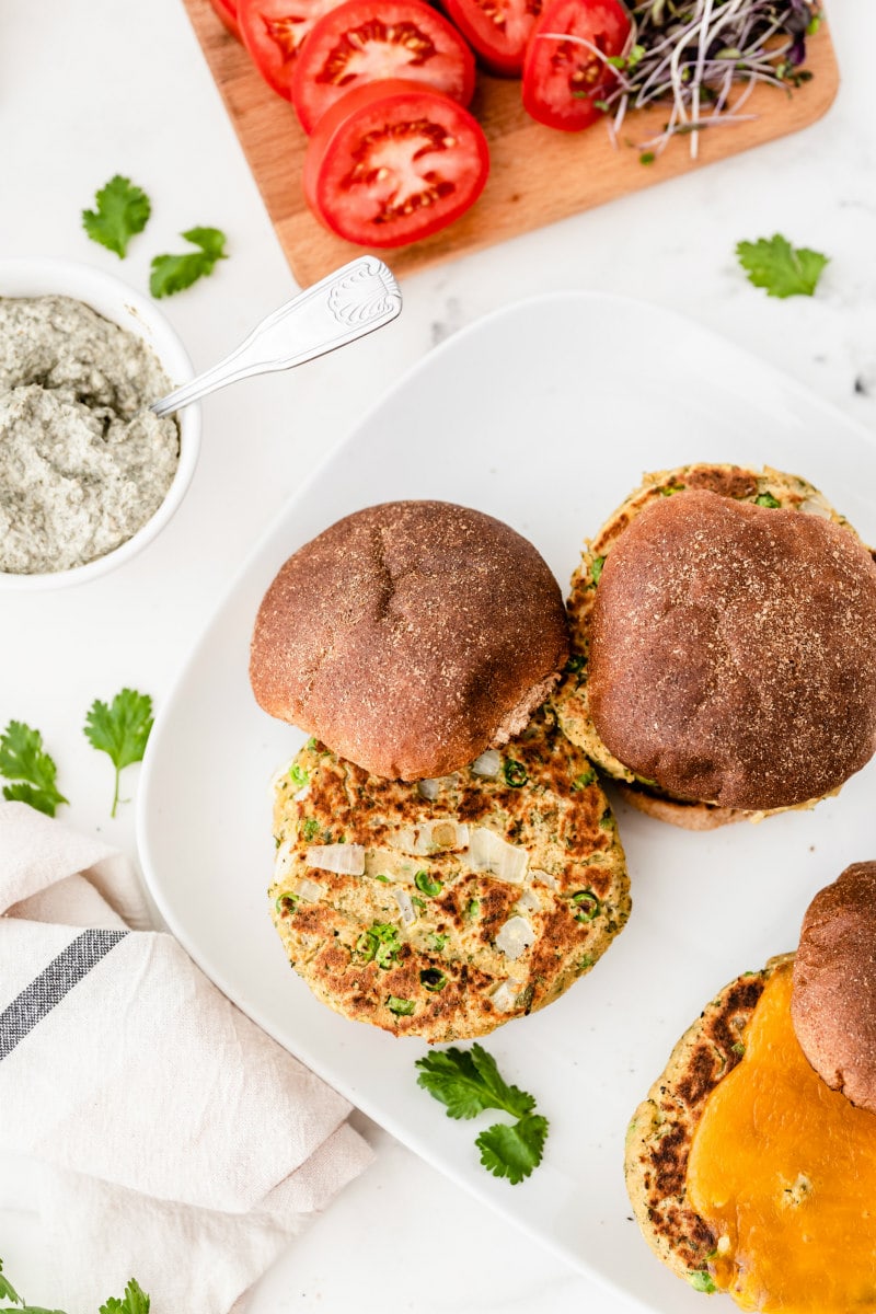 veggie burger with fun on white plate with no condiments