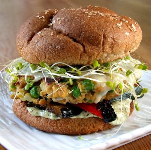 Veggie Burgers with Cilantro Mayonnaise recipe from RecipeGirl.com #veggie #burgers #cilantro #mayonnaise #recipe #RecipeGirl Veggie burger on a white plate