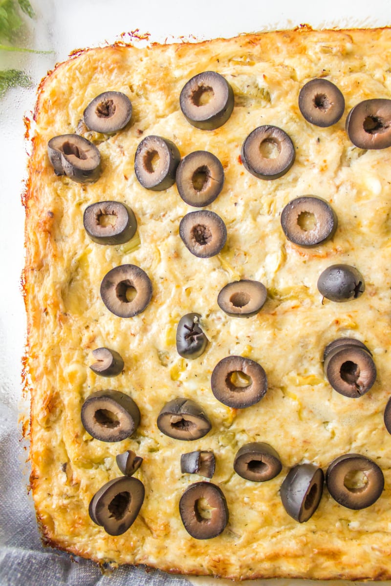 warm crab dip topped with black olives