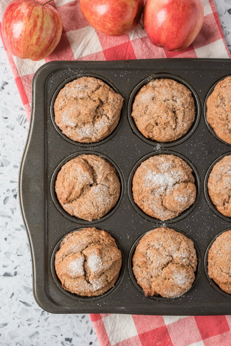 overhead shot of apple muffins in muffin tin