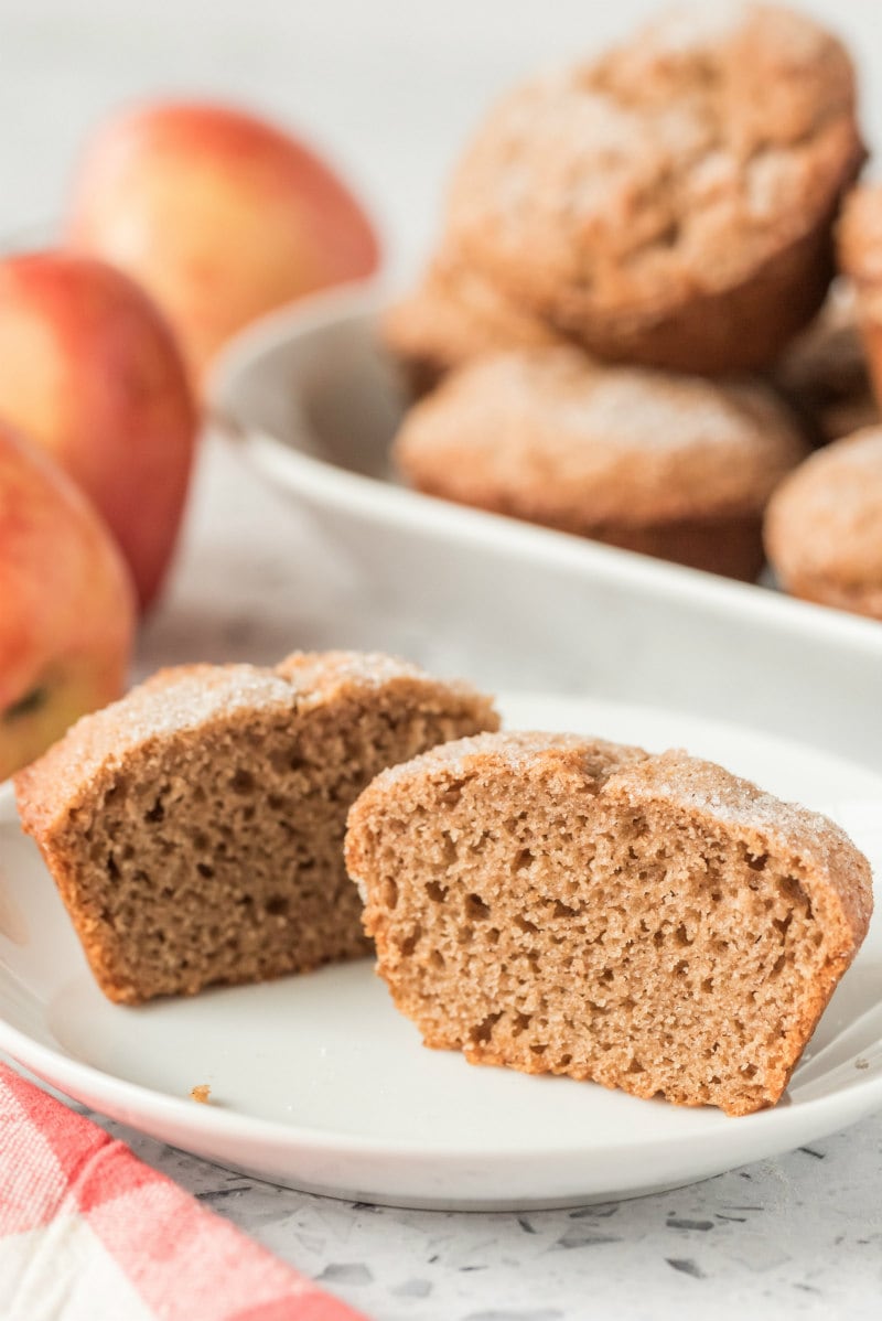 apple butter muffin cut in half on a white plate