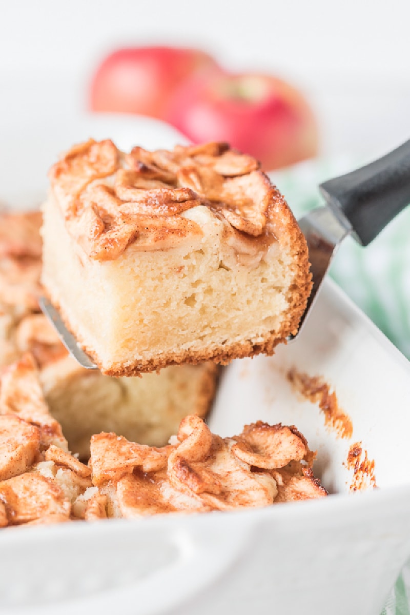 spatula taking out slice of apple coffee cake out of pan
