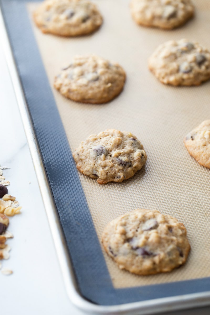 banana walnut chocolate chip cookies just out of the oven on a baking sheet