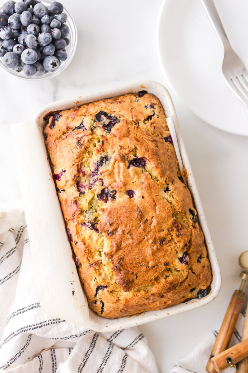 loaf of blueberry zucchini bread in pan
