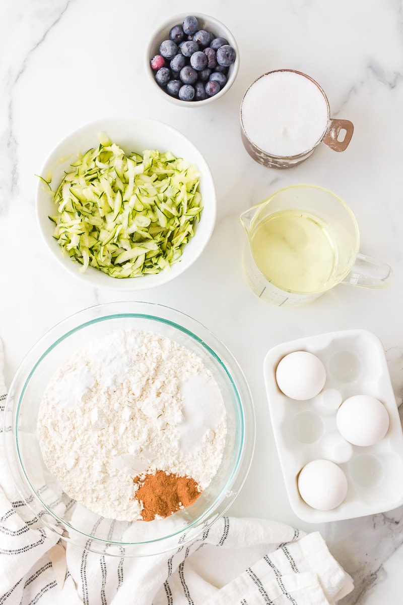 ingredients displayed for making blueberry zucchini bread