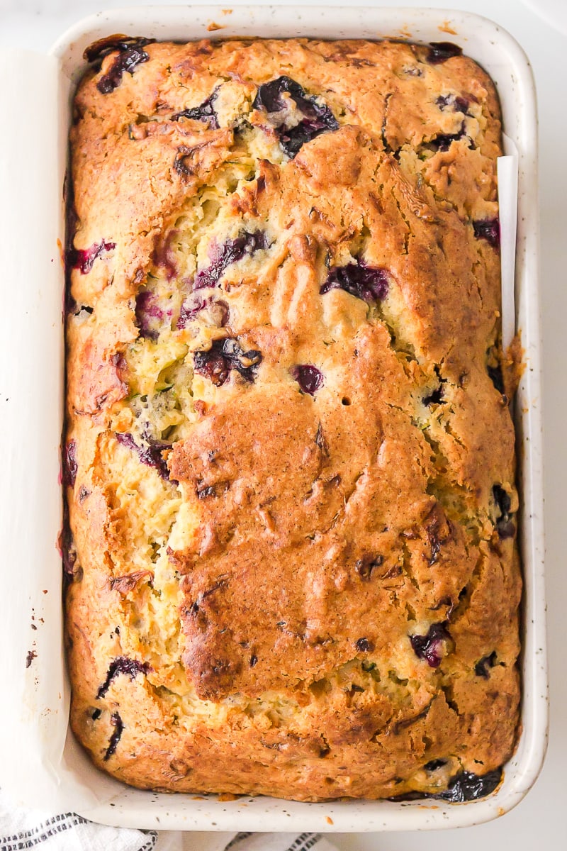 loaf of blueberry zucchini bread in pan