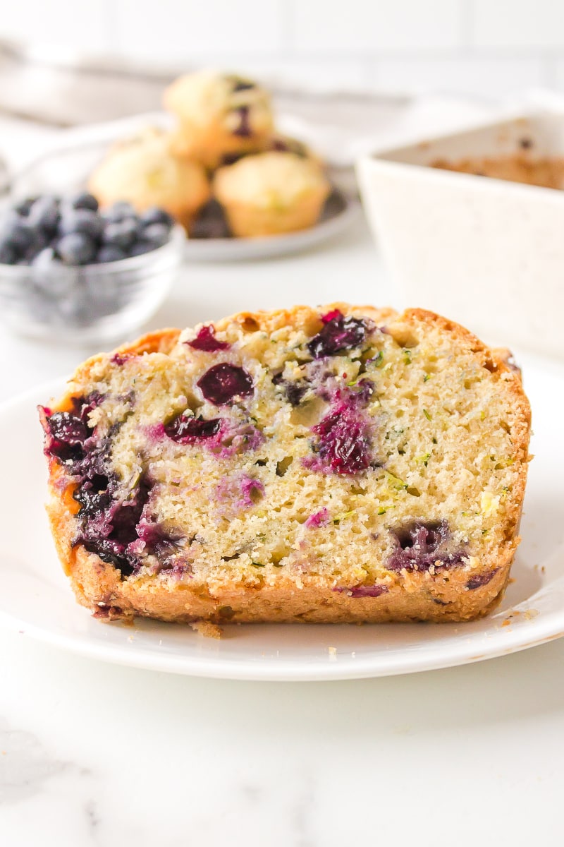 slice of blueberry zucchini bread on plate