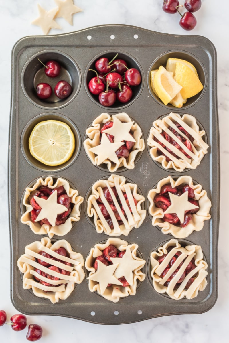 cherry pie cups in muffin tin ready for the oven