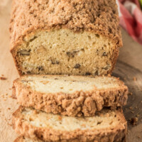 loaf of dutch apple bread on cutting board sliced