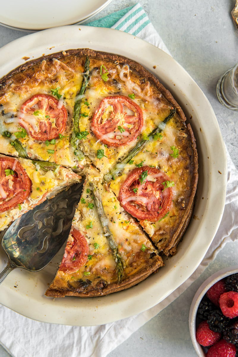 overhead shot of slicing garden vegetable quiche