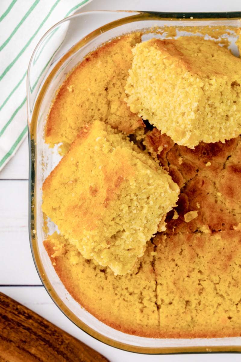 slices of cornbread sitting on top of pan of cornbread