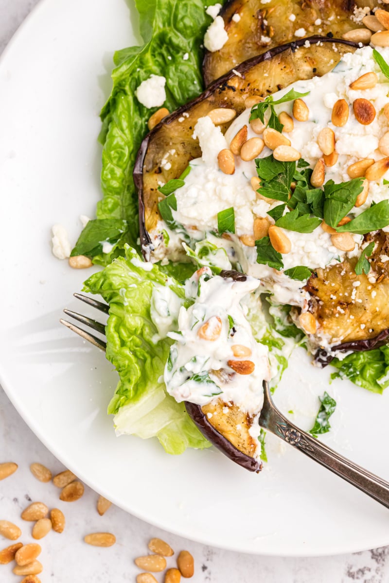 fork full of grilled eggplant salad