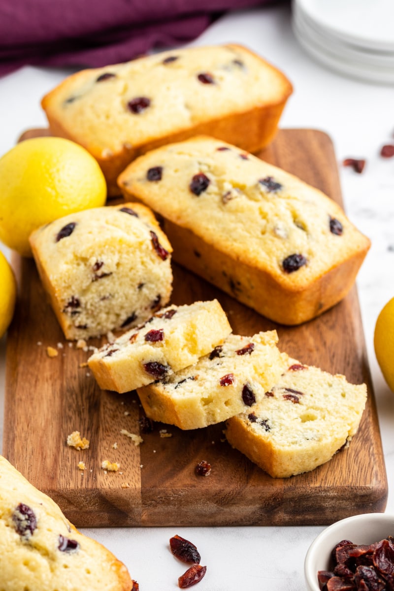 lemon cranberry mini loaves sliced on cutting board