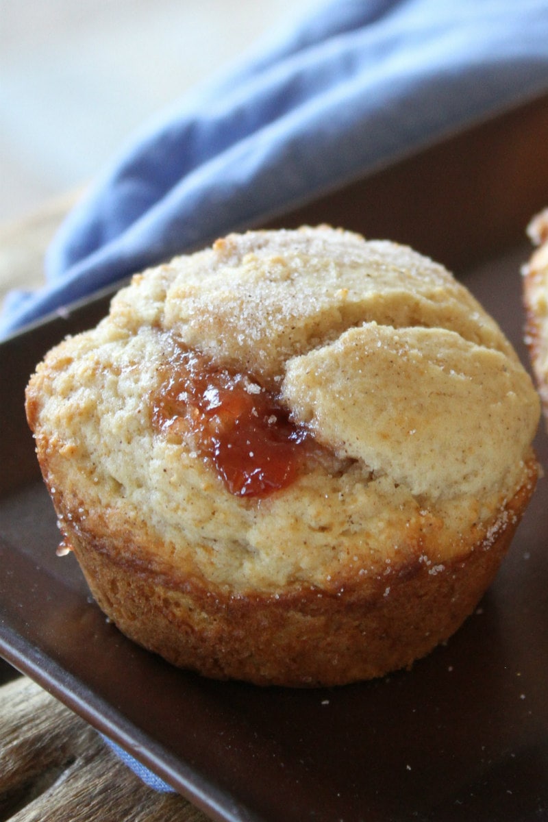 strawberry cinnamon muffin with a blue napkin displayed in background