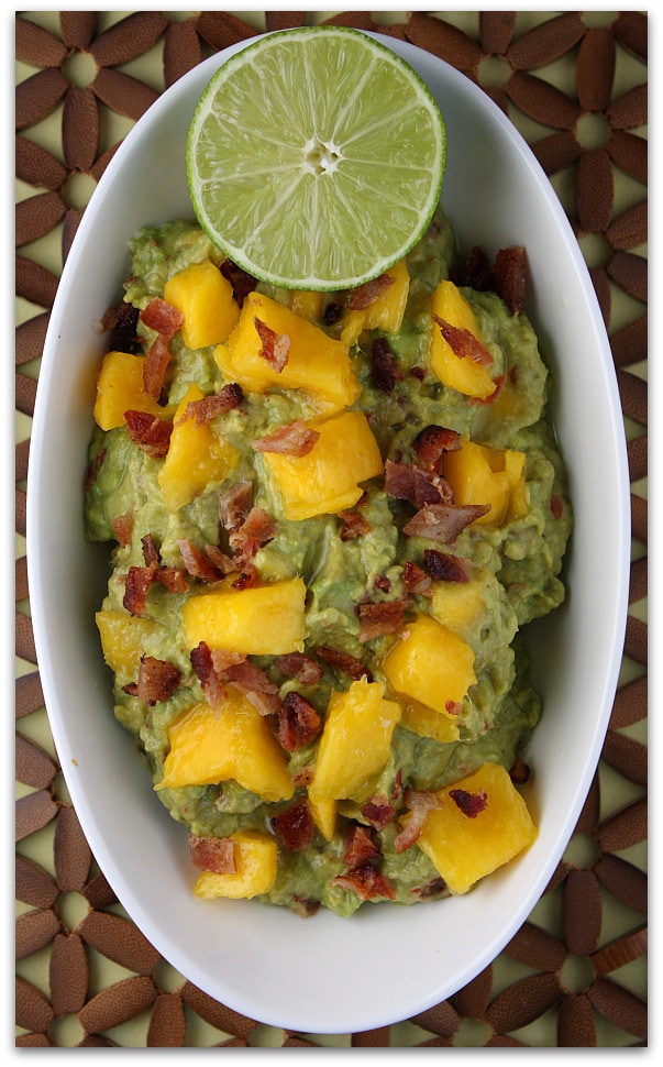 bowl Sweet and Smoky Mango Guacamole with lime