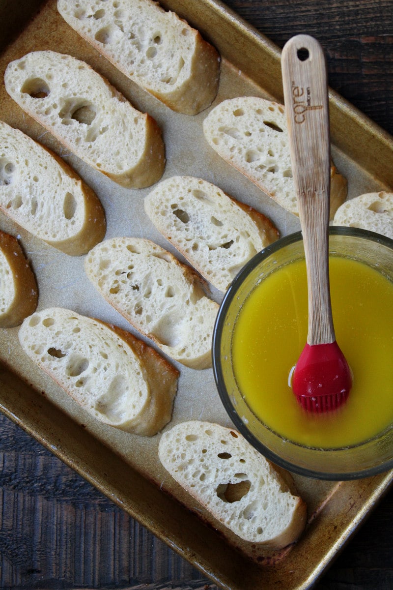 How to Make Parmesan Baguette Croutes : baguette slices ready to spread with garlic butter