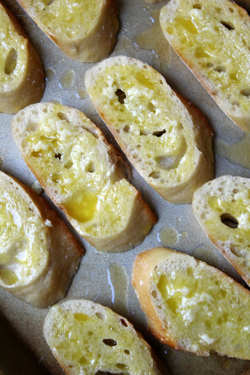 How to Make Parmesan Baguette Croutes : baguette slices with garlic oil