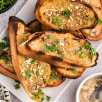 peppery grilled garlic bread on a plate