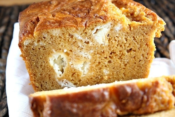 loaf of pumpkin cream cheese swirl bread sliced open