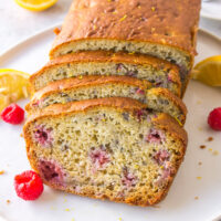 raspberry lemon loaf on plate cut into slices