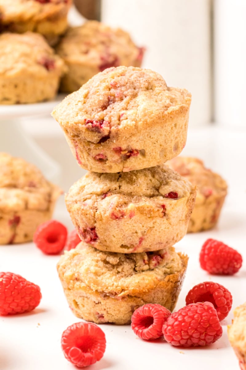 three raspberry muffins stacked