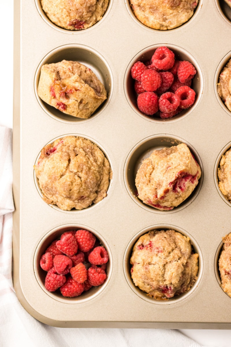 raspberry muffins in muffin pan