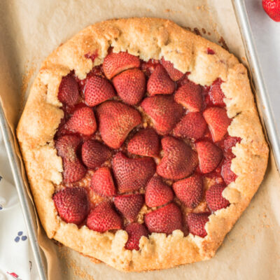 rustic strawberry galette on baking sheet