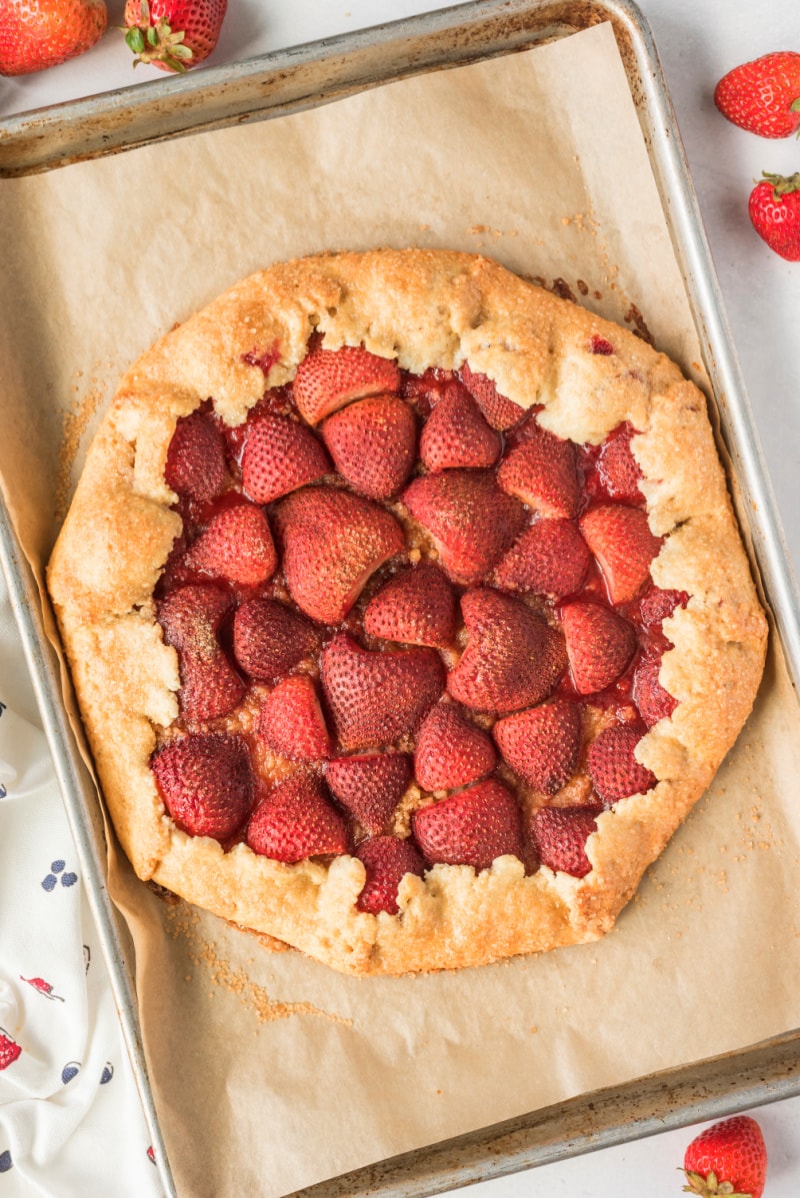 rustic strawberry galette on baking sheet