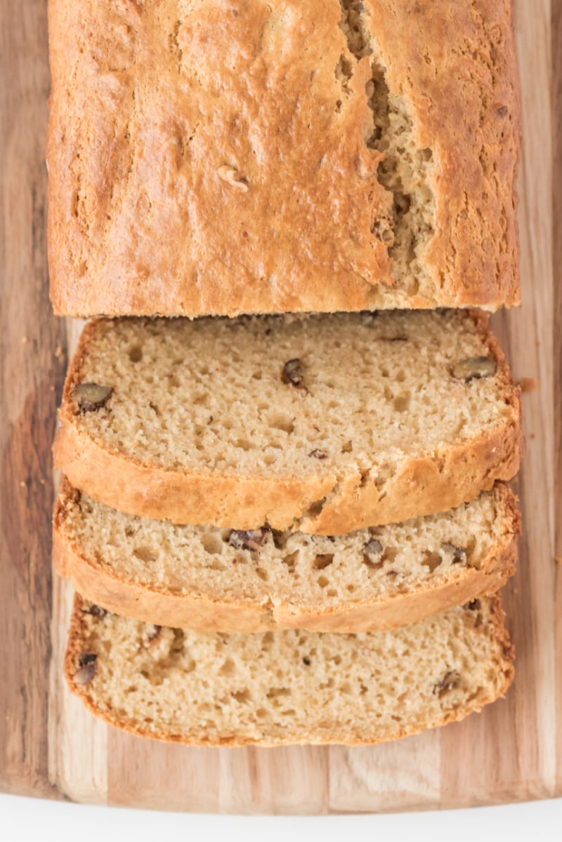 loaf of sour cream maple bread cut on cutting board