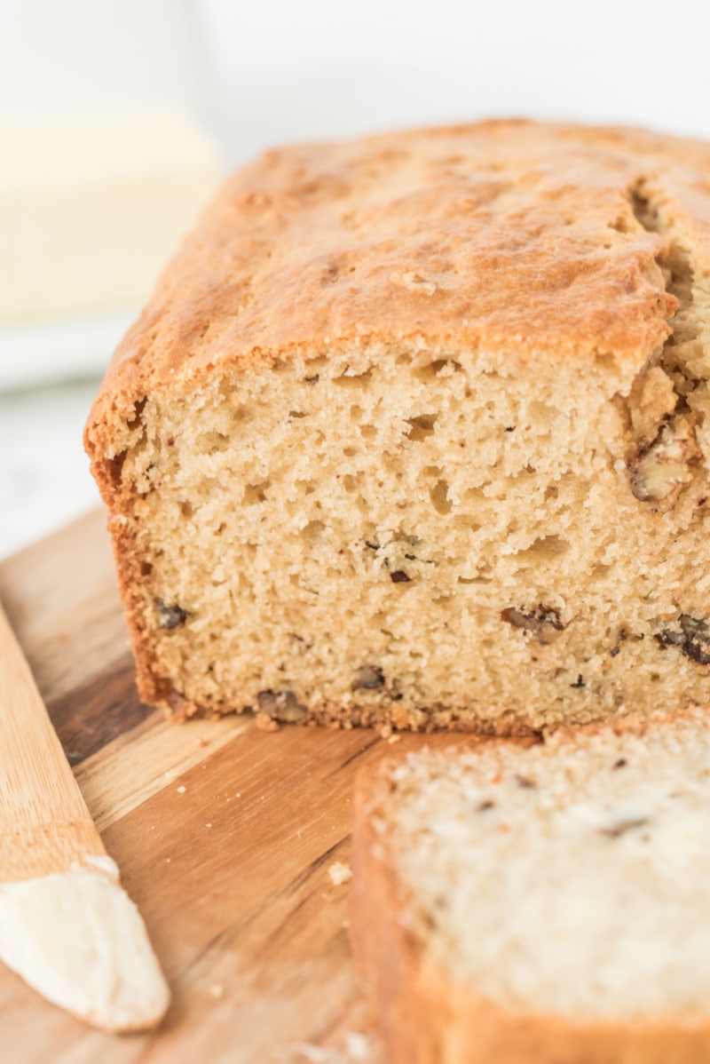 loaf of sour cream maple bread cut into