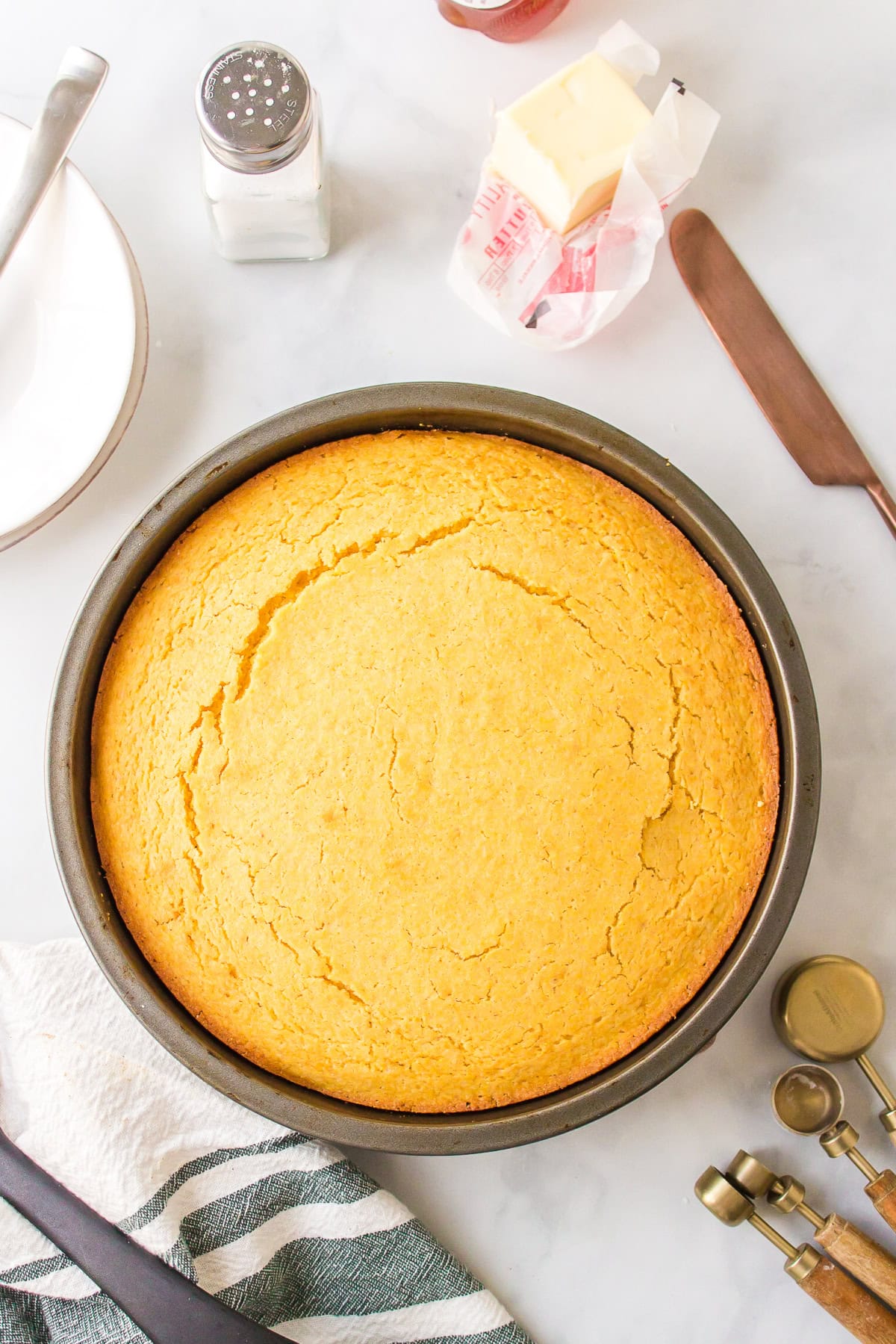 Sweet, moist, and buttery — this easy sweet cornbread recipe is the ultimate comfort side for chili, soups, and BBQ. Ready in under 30 minutes! Sweet cornbread in a round pan