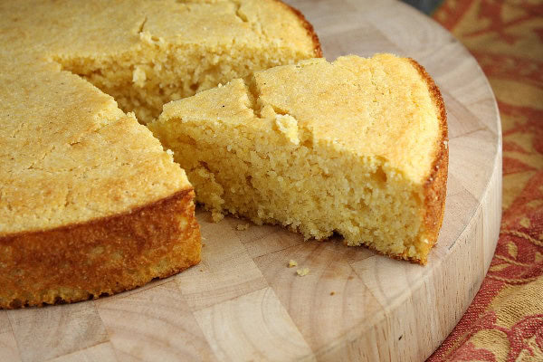 cornbread with a wedge cut out of it