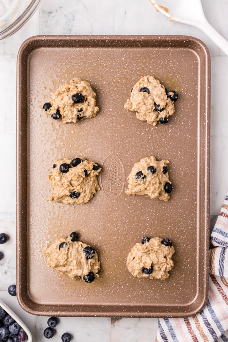 blueberry biscuits on a baking sheet ready for oven