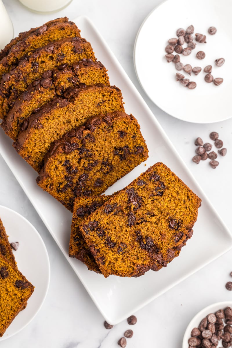 slices of chocolate chip pumpkin bread on platter