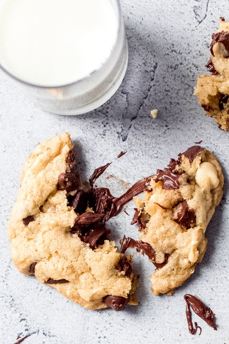 Breaking a warm chocolate chip cookie apart