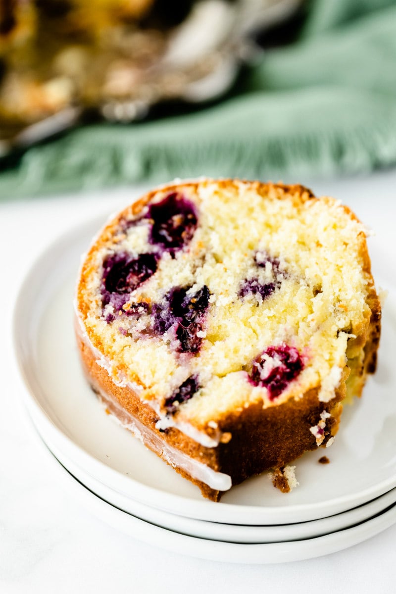 slice of blueberry pound cake on a white plate