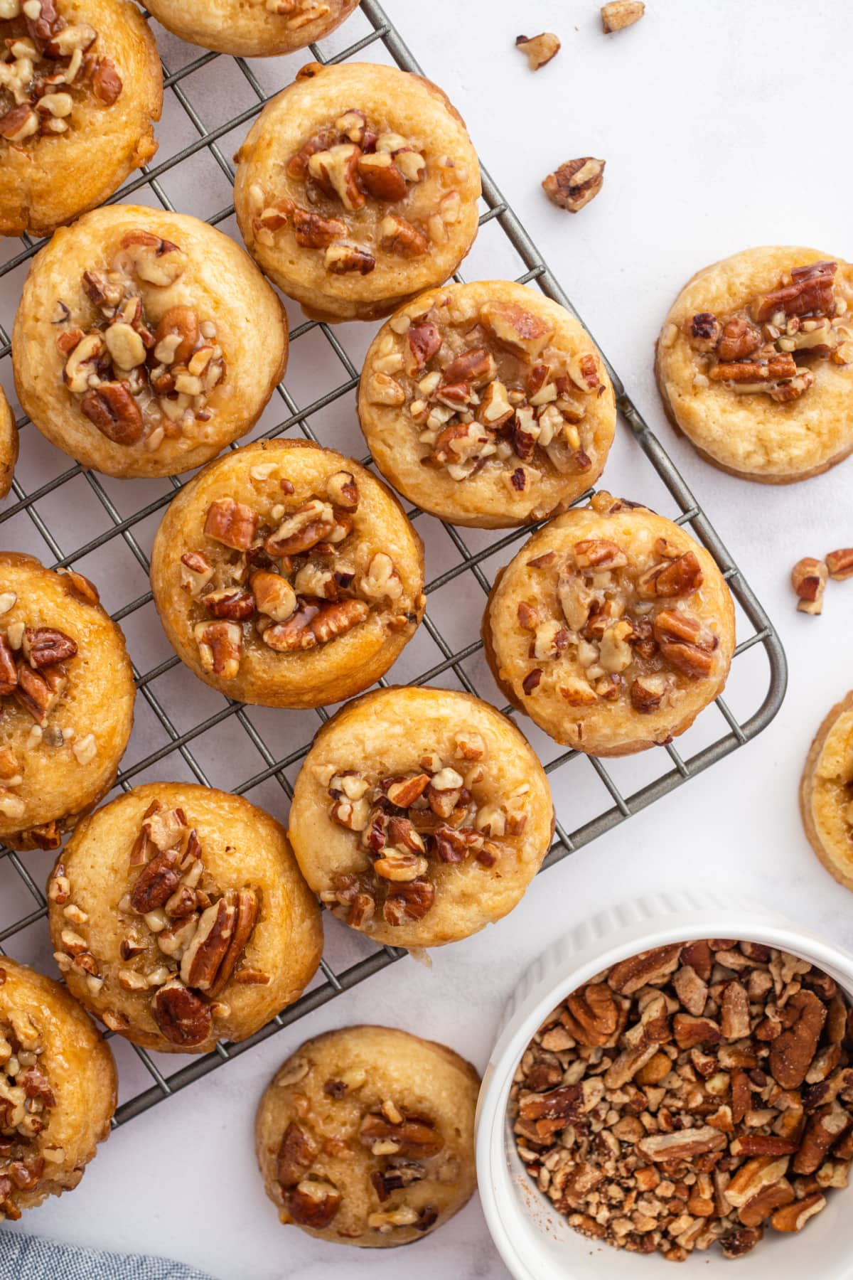 caramel pecan sticky bun cookies on a baking rack