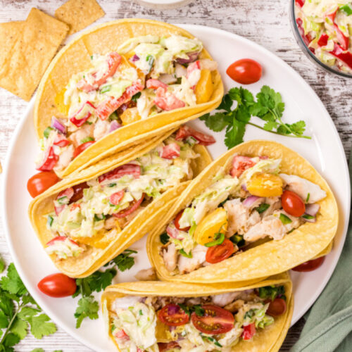 fish tacos with citrus salsa on a plate