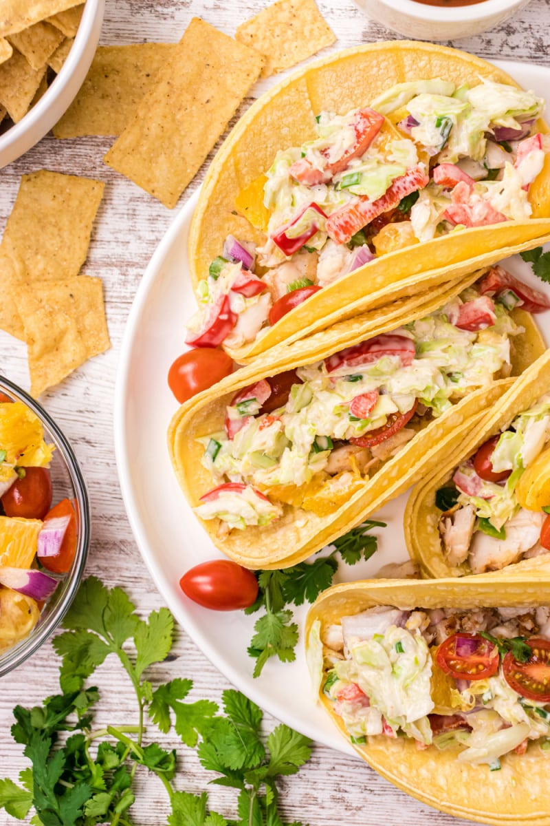 fish tacos with citrus salsa on a plate