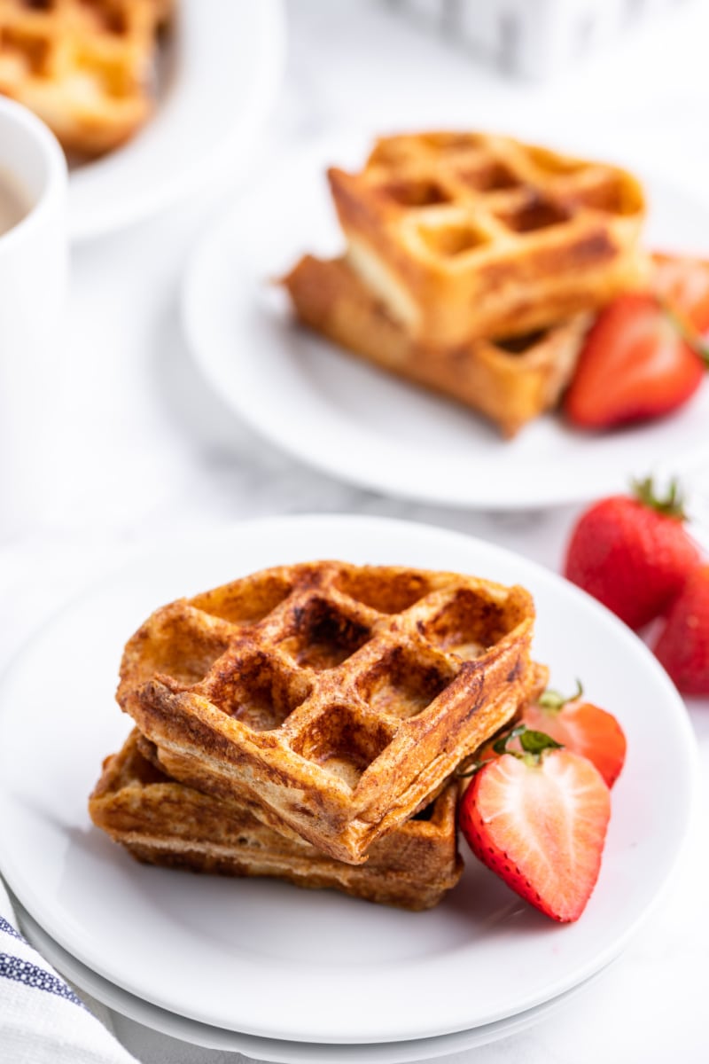 french toast waffles on a plate with strawberries