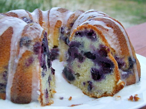 blueberry lime pound cake with glaze cut open to see the inside of the cake