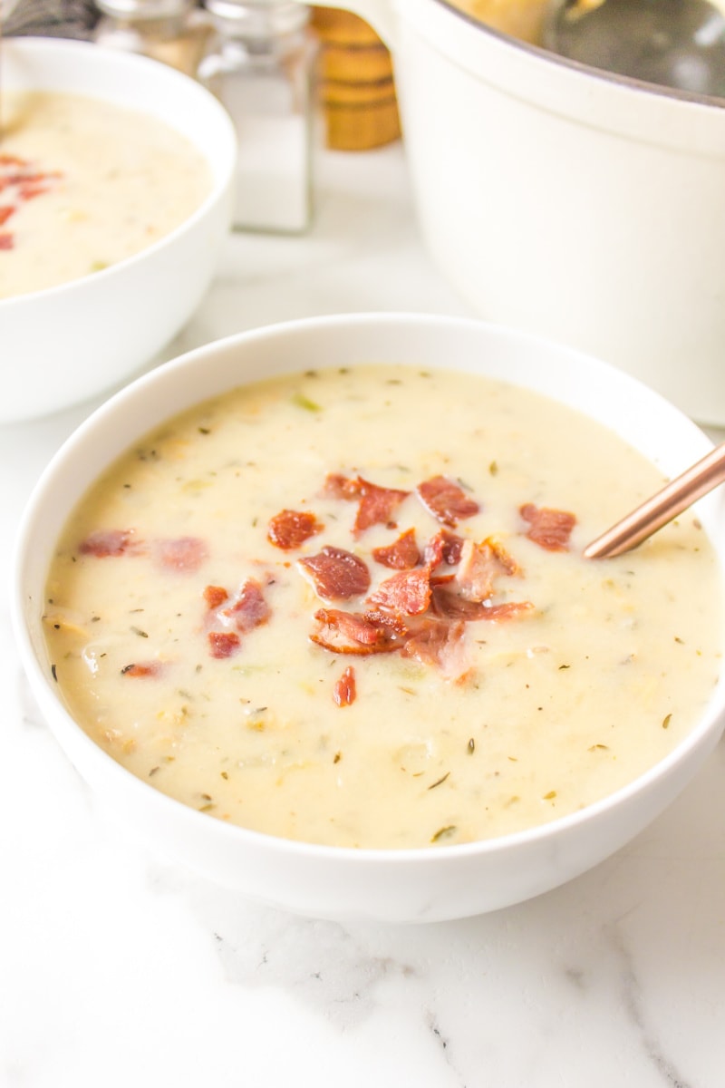 low fat clam chowder in a bowl topped with bacon