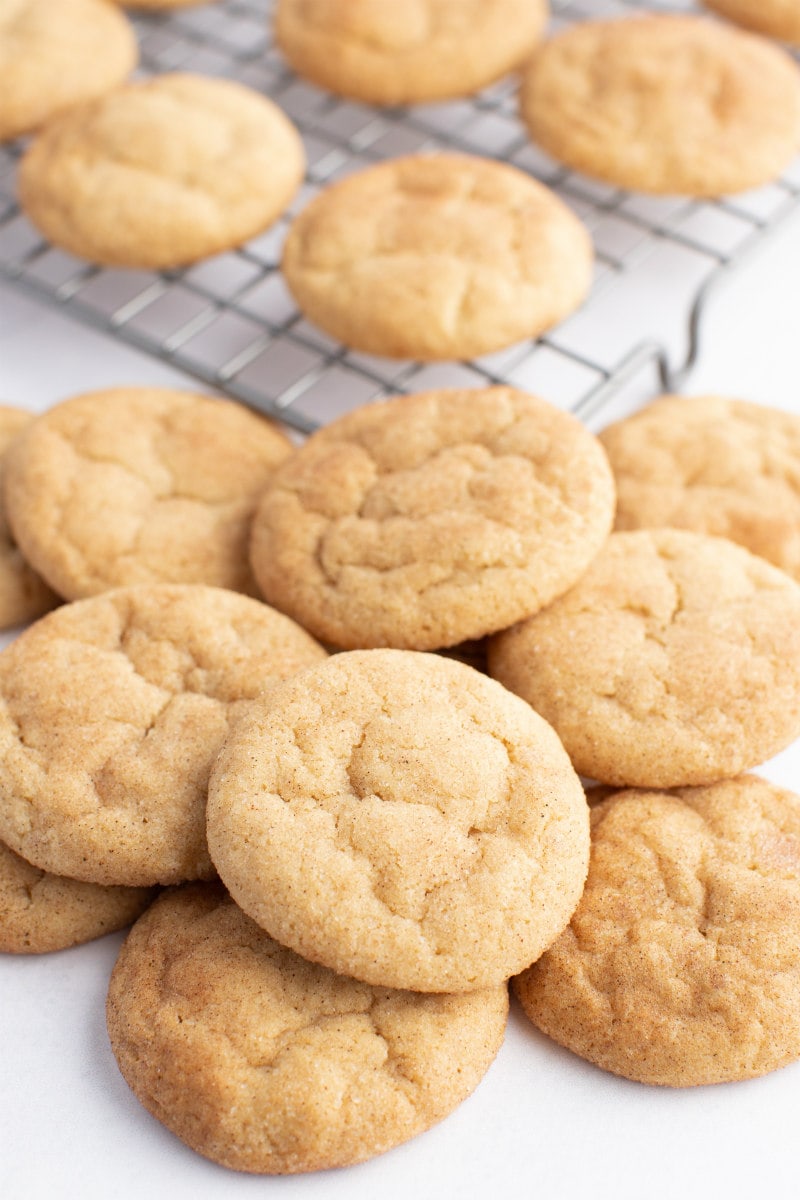 maple cookies on a cooling rack and piled on the side