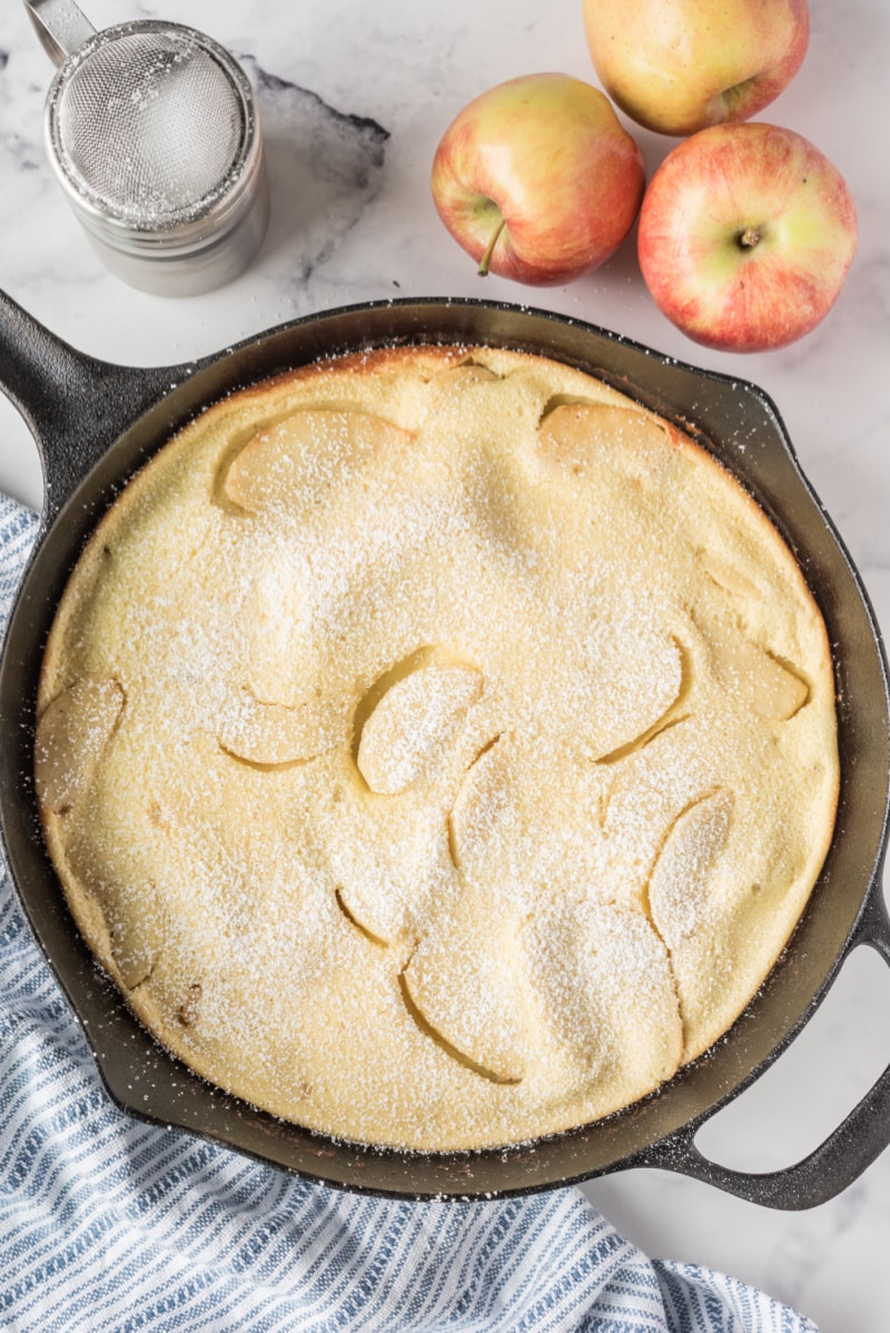 big apple pancake in a cast iron skillet