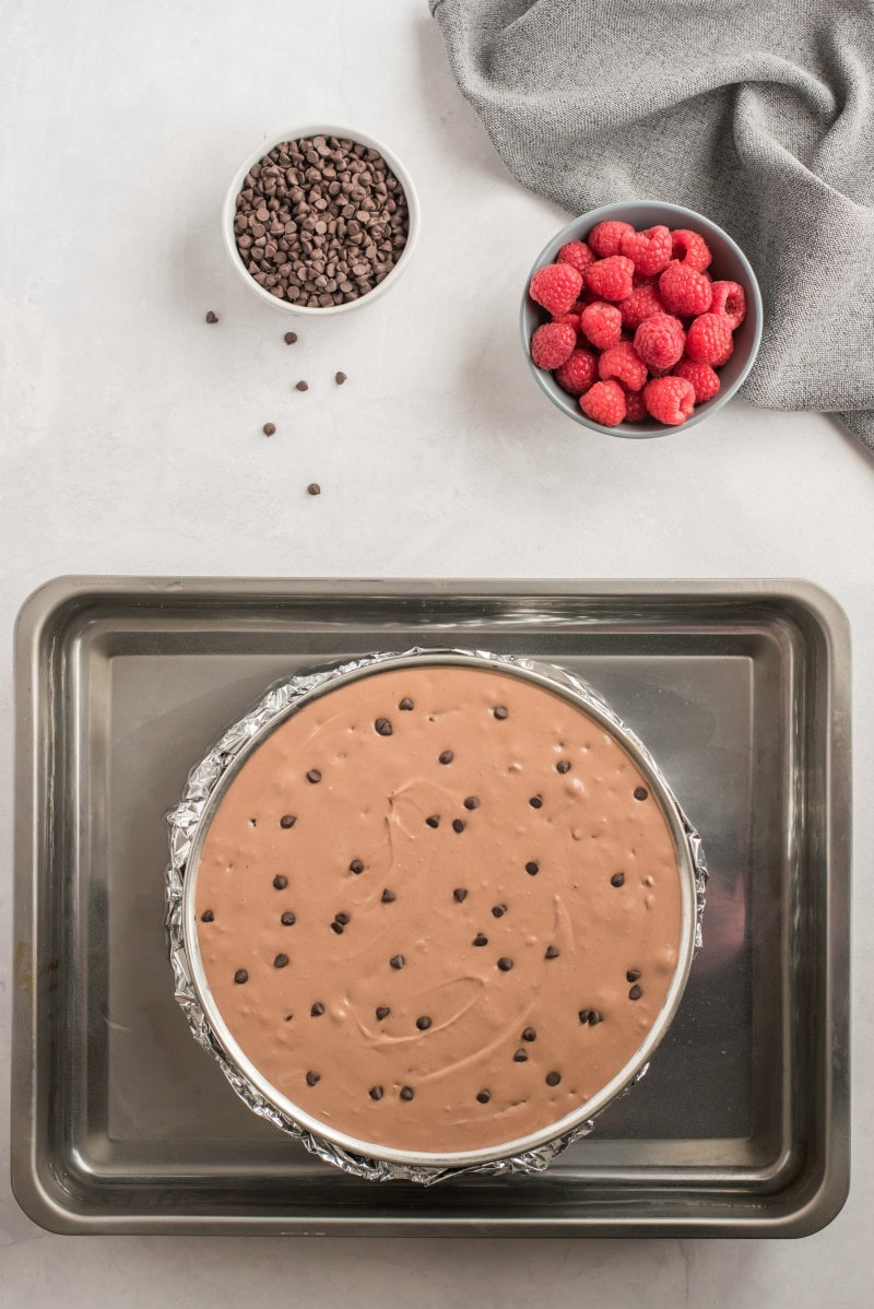 chocolate chip cheesecake in water bath ready for oven