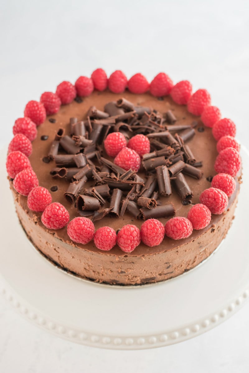 chocolate chocolate chip cheesecake with raspberry garnish