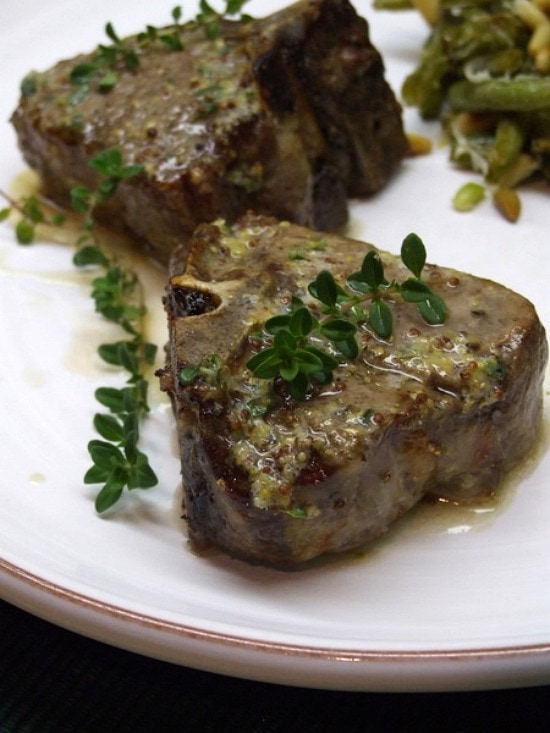 Lamb Chops with Lemon, Thyme and Mustard Butter on a plate